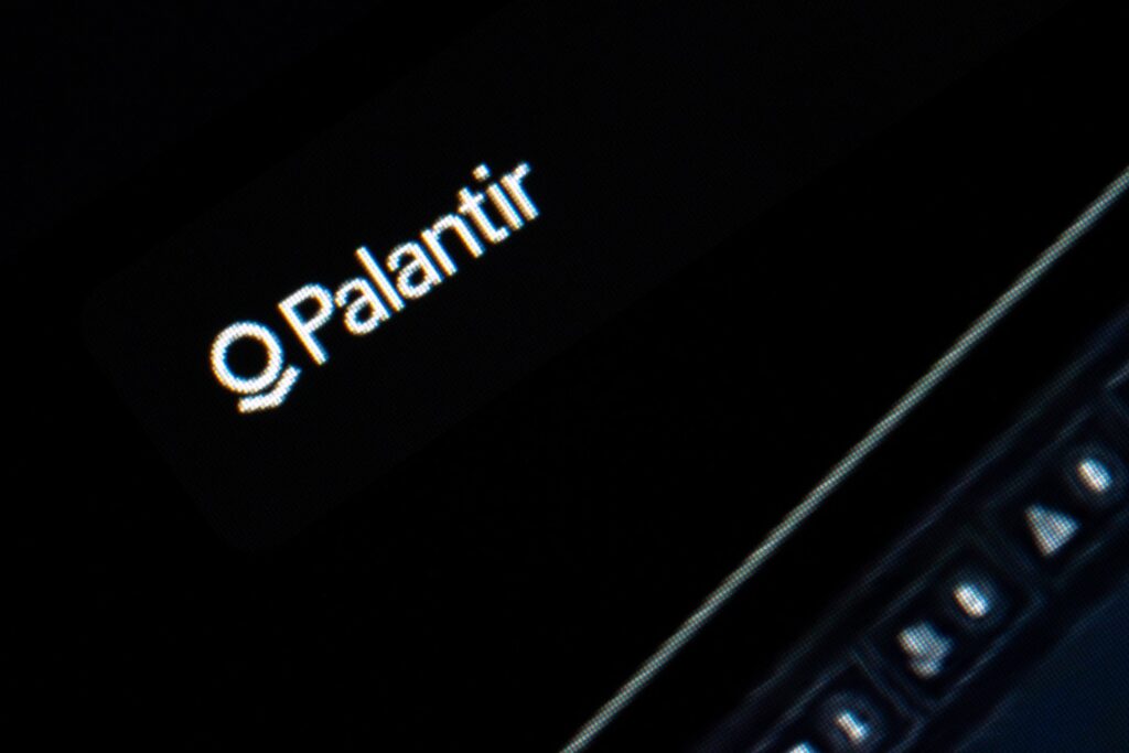 Close-up of the Palantir logo displayed on a dark digital interface, capturing a minimal and abstract technology aesthetic.