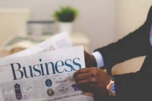 Businessman opening a paper